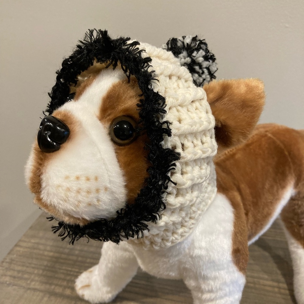 Cream color dog hat/hood with faux fur trim in black With two-tone pom-pom